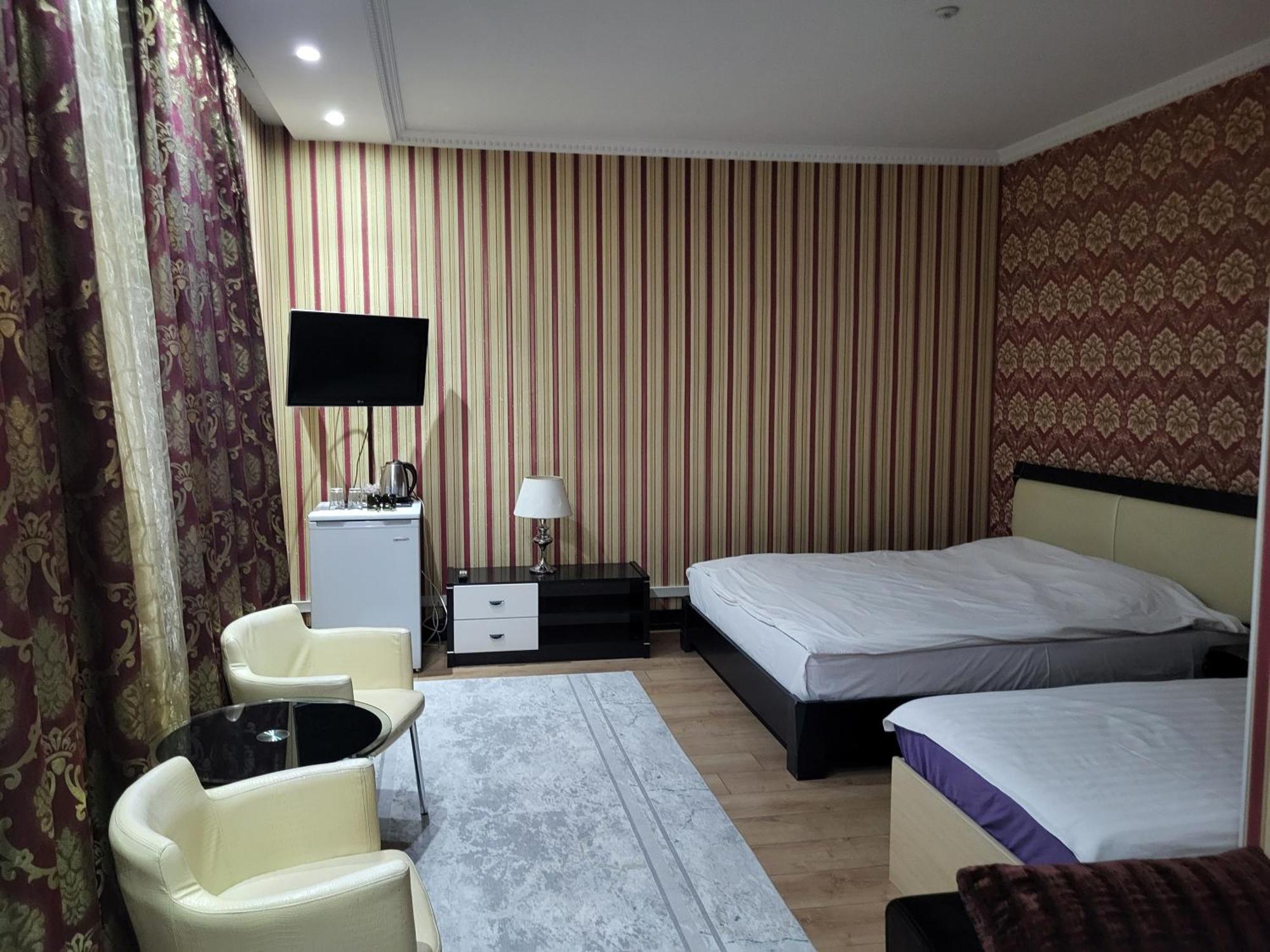 Seoul Hotel Shymkent Habitación foto